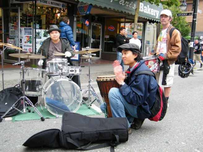 A band sets up in the street.