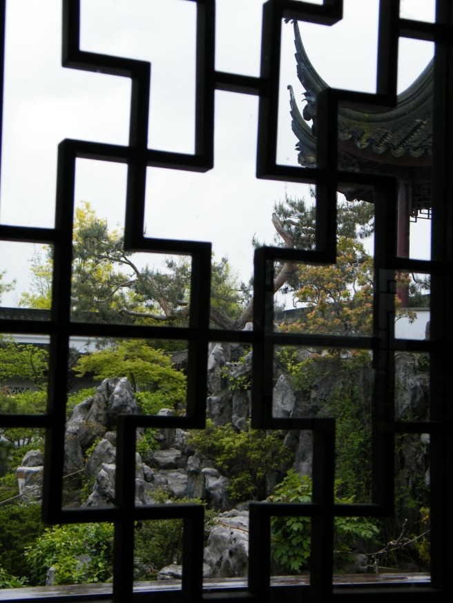 Through a window onto the garden. Through a window onto the garden.