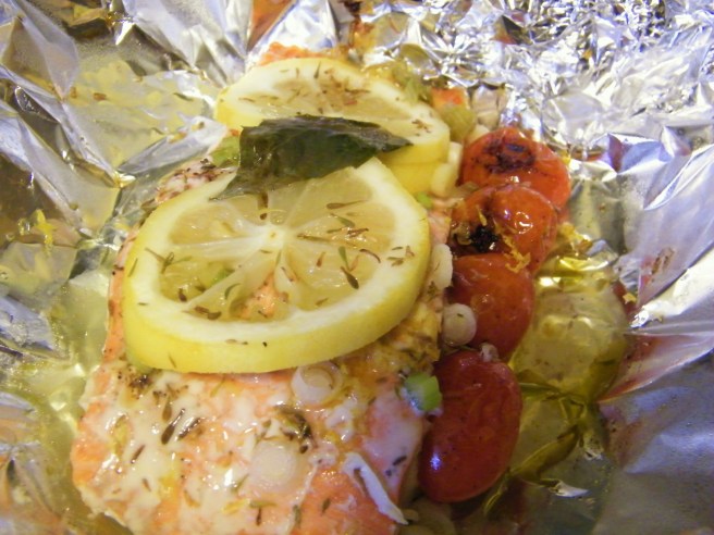 The salmon, just out of the oven and still resting on tin foil.