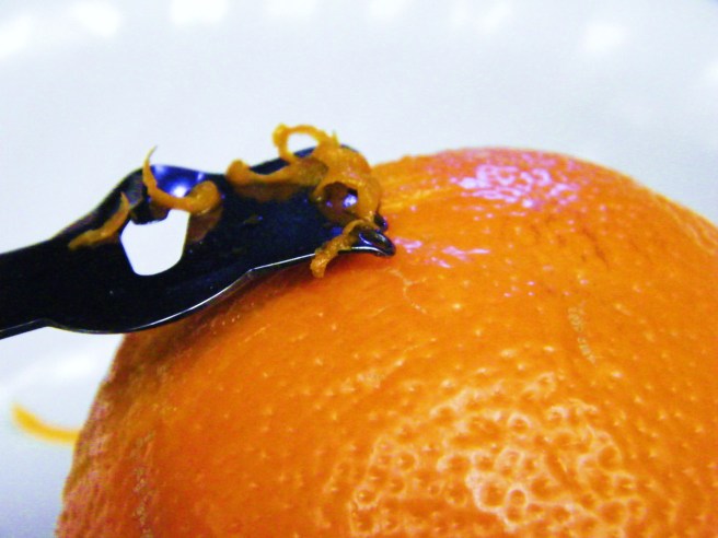 Zesting an orange.