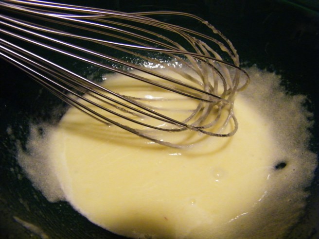 Mixing the egg yolks with the sugar. Mixing the egg yolks with the sugar.