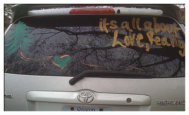 It's all about love, really - painted on a car window.