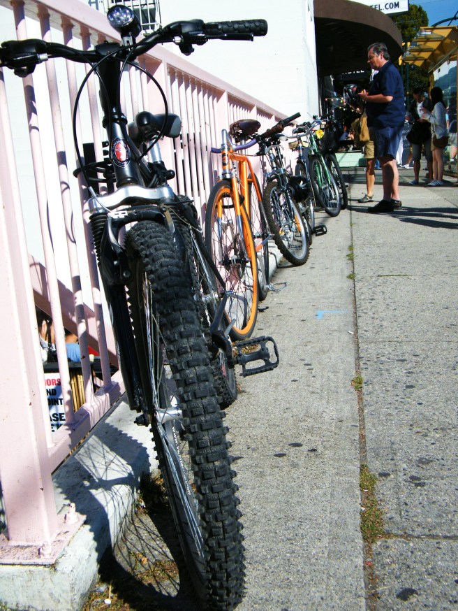 Bikes locked to the railing at the Waldorf Hotel.
