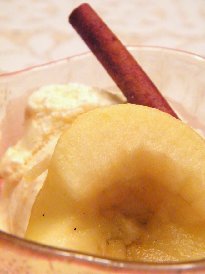 Poached apple, with Pralines and Cream Ice Cream and a garnish of cinnamon stick.