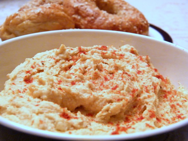 Hummus, with home-made bagels in the background.