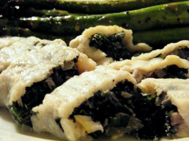 Sole stuffed with kale and quick-preserved lemons, with roasted asparagus in the background.